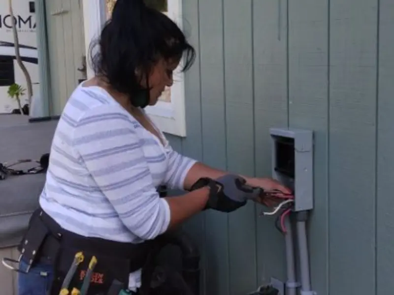 Licensed electrician wiring an exterior subpanel in Washougal